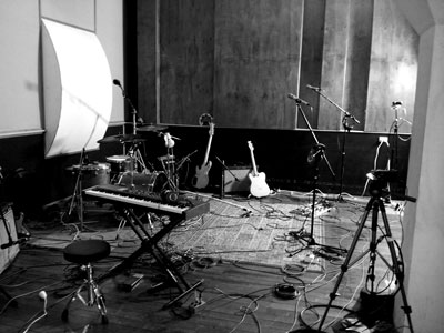 image of live recording setup with keyboard and drums