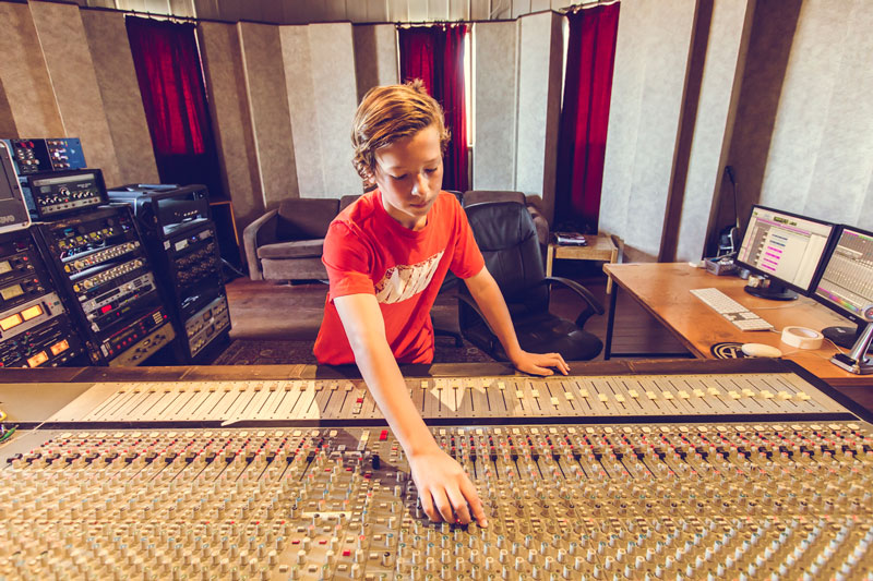 SoundClicks student learning the mixing console